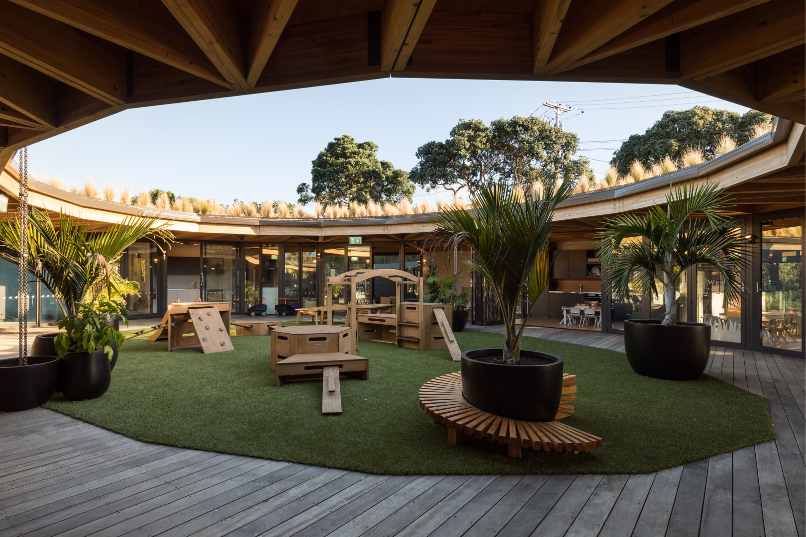 The outside playground area of the circular Kakapo Creek building
