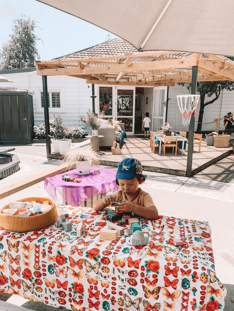 Child playing with toys outside at childcare centre