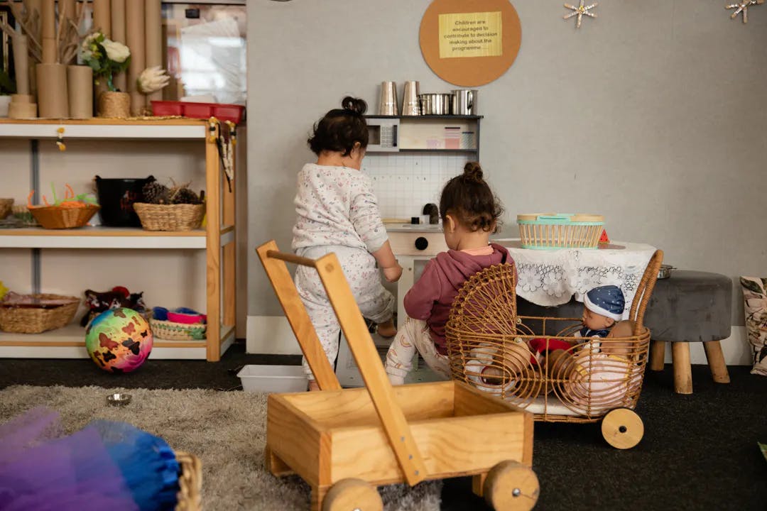 Toddlers playing together in classroom playarea