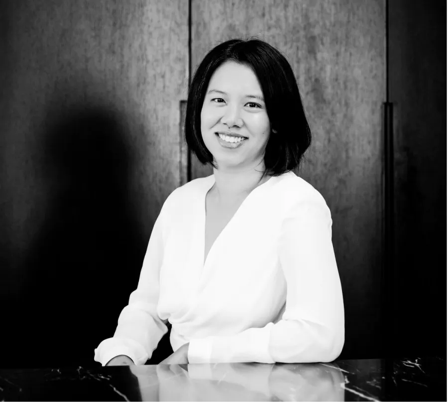 Stephanie Pow sitting at her desk