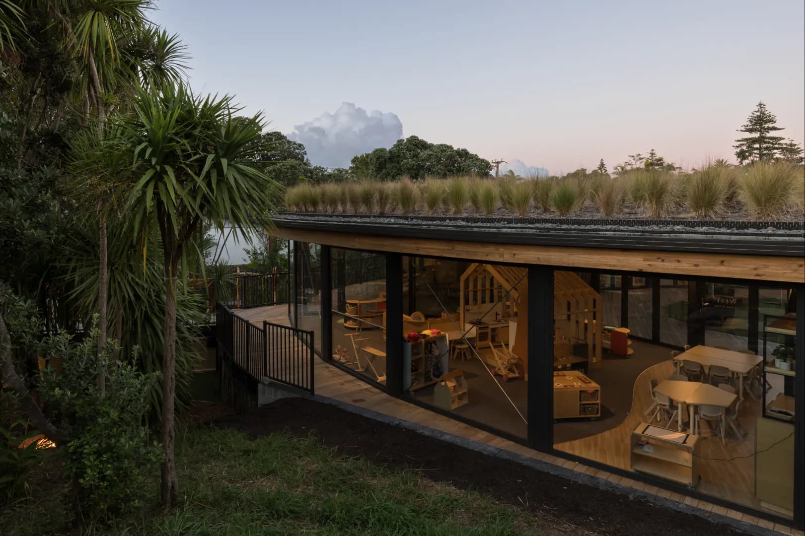 Kakapo Creek Childrens Garden at sunset, highlighting the green roof and outdoor area