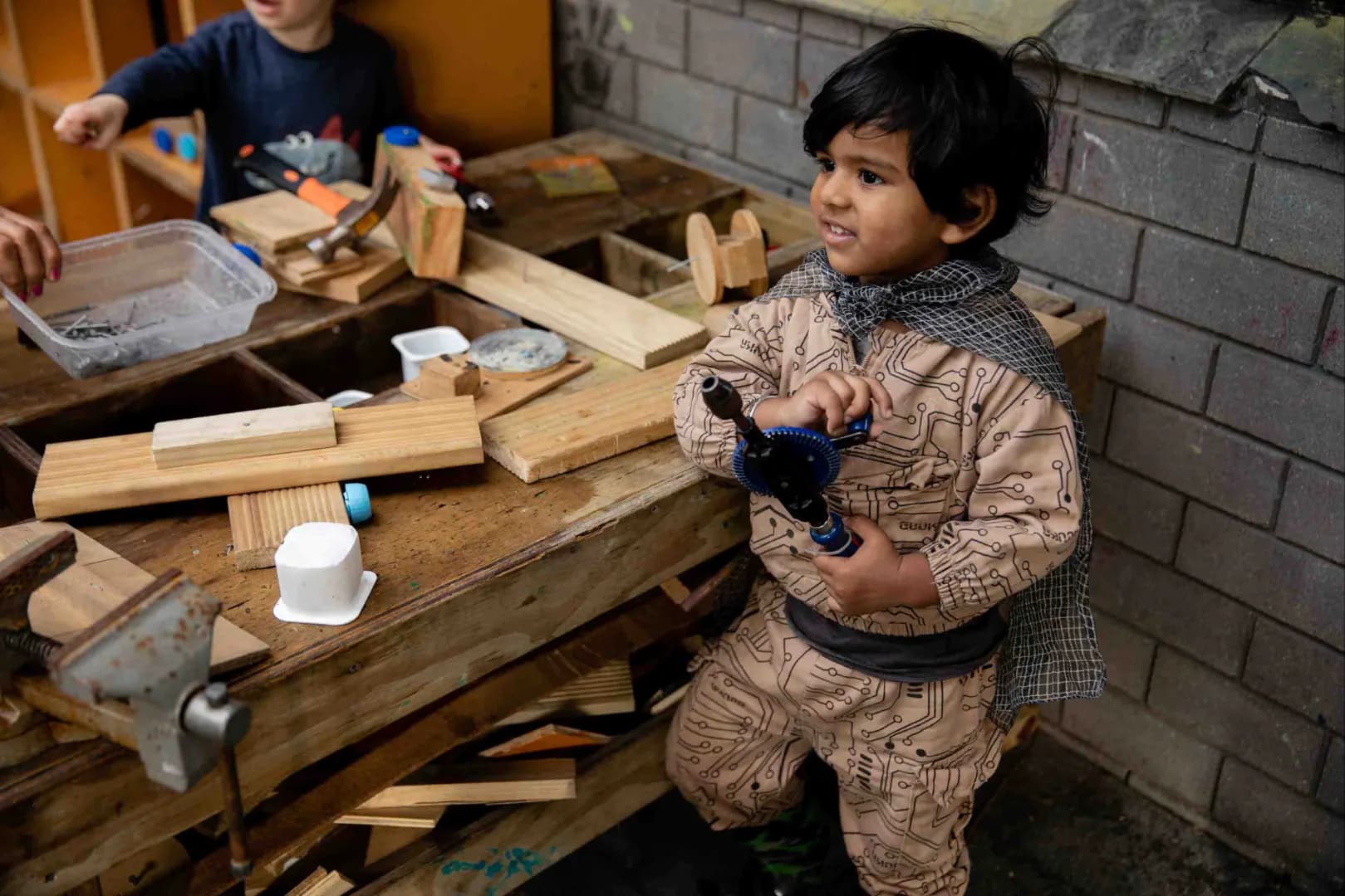 Child playing in workshop